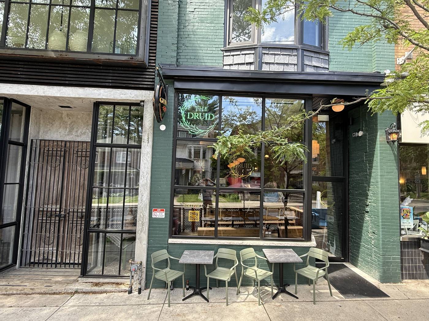 Black anodized aluminum flush-glazed storefront and second-storey window system at The Hawthorne in Scarborough, supplied and installed by Canuck Door Systems