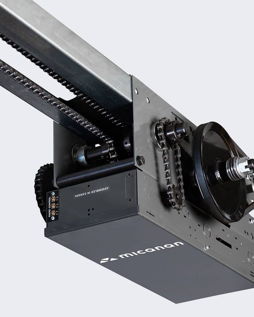 A trolley-type industrial sectional door operator of the kind installed on commercial overhead doors