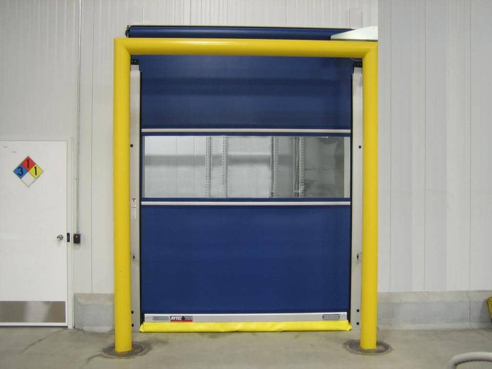 A high-speed rolling fabric door in an industrial opening, of the type supplied and installed by Canuck Door Systems