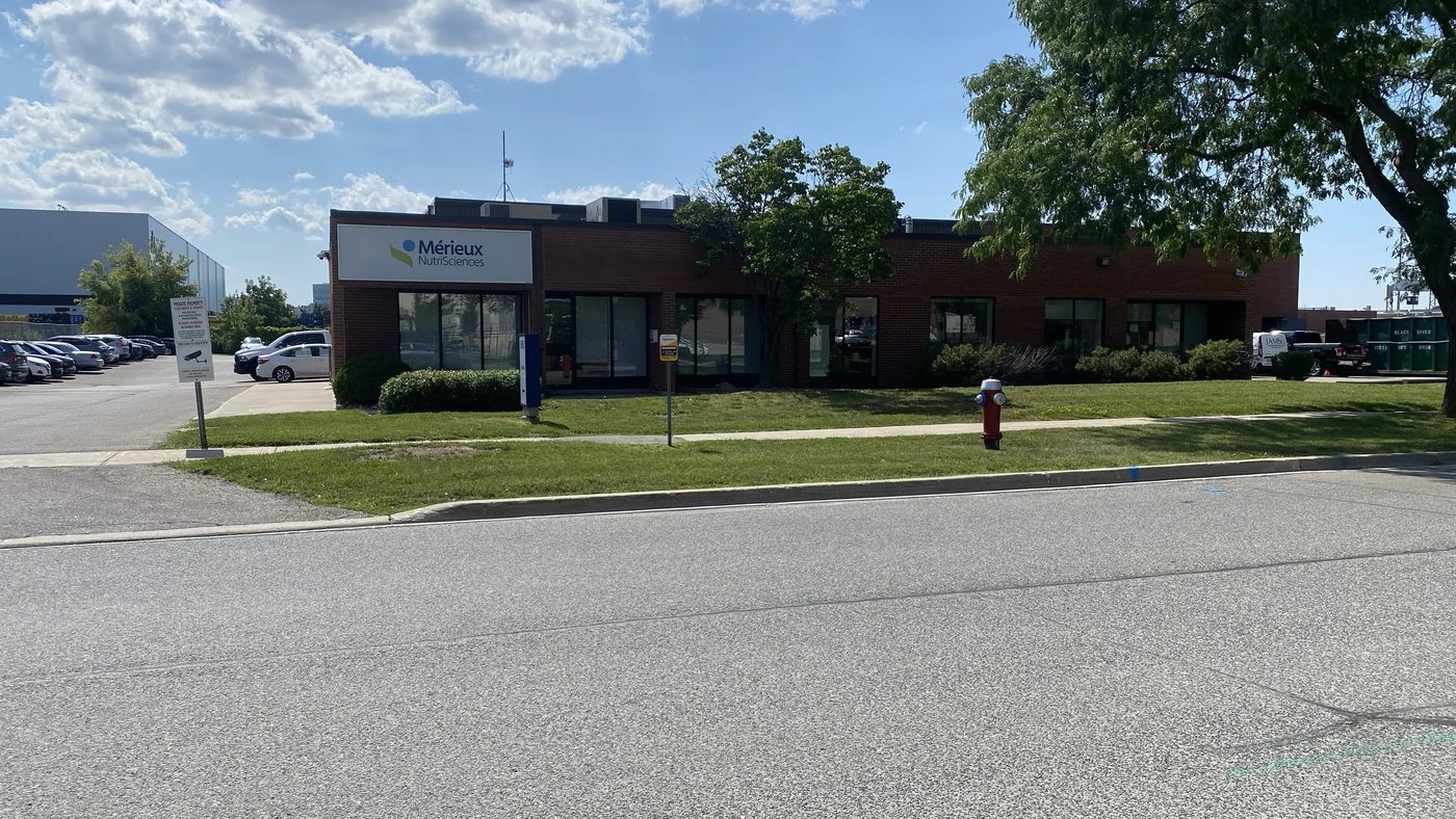 The single-storey brick laboratory building in Mississauga where Canuck Door Systems replaced the aluminum storefront entrance door