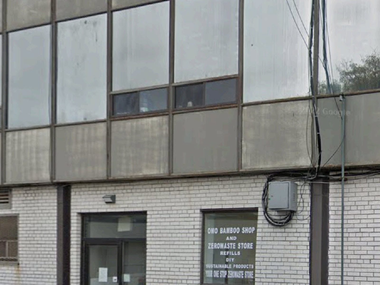 The front of one of the buildings at 777 Warden Avenue in Scarborough, with glazed openings and entrance doors along the ground floor below a band of upper windows, fitted by Canuck Door Systems