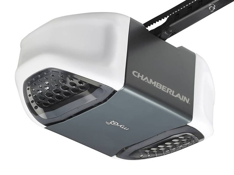 A Chamberlain chain-drive garage door opener, the white and grey motor unit with its two lens panels and the toothed rail attached at the back