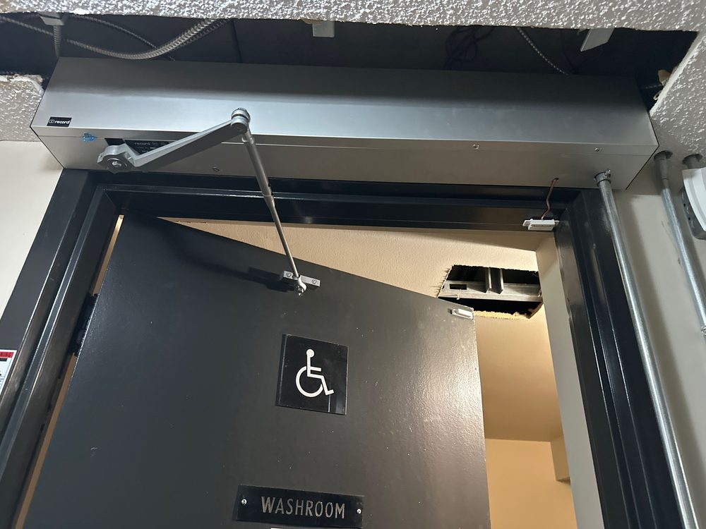 Universal washroom door package installed by Canuck Door Systems