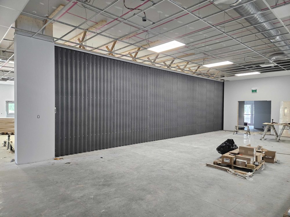 Folding accordion partition installed by Canuck Door Systems