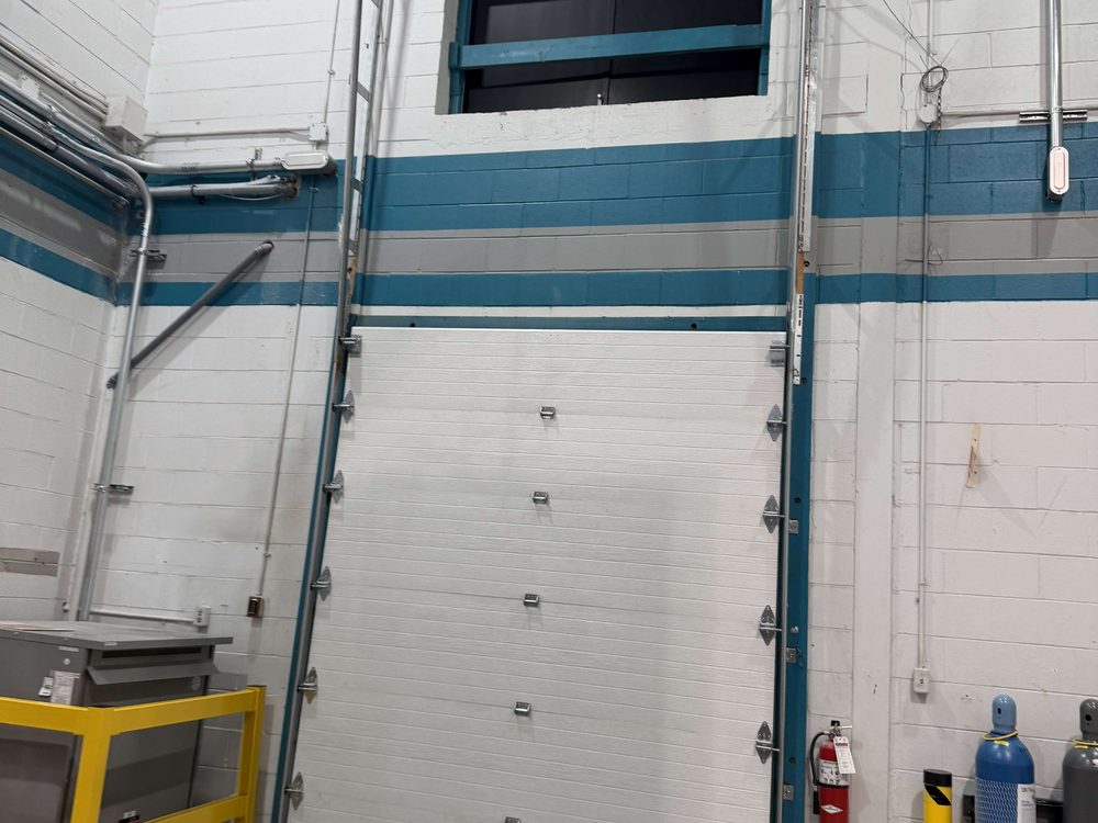 Commercial sectional overhead door installed by Canuck Door Systems for Ontario Inc in Toronto
