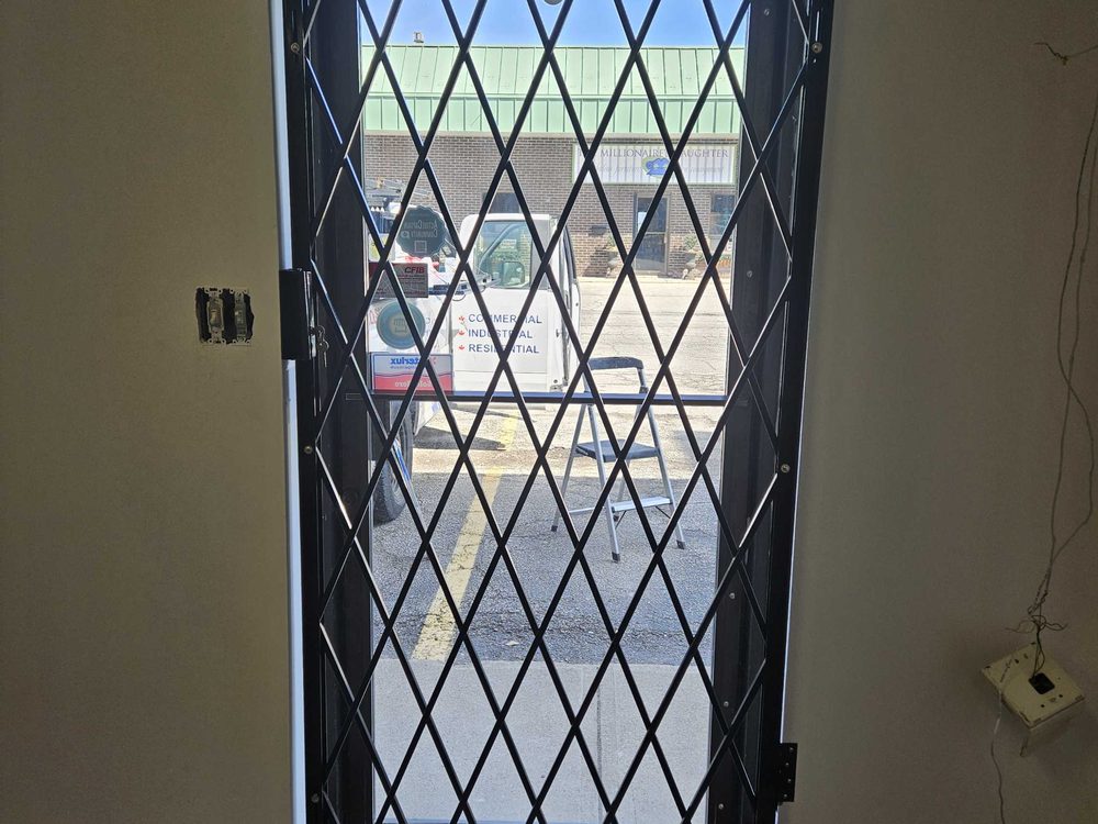 Side-folding security grille installed by Canuck Door Systems
