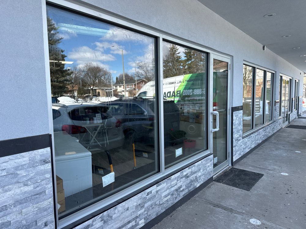 Aluminum storefront elevation installed by Canuck Door Systems for ICNA Relief Canada in Mississauga