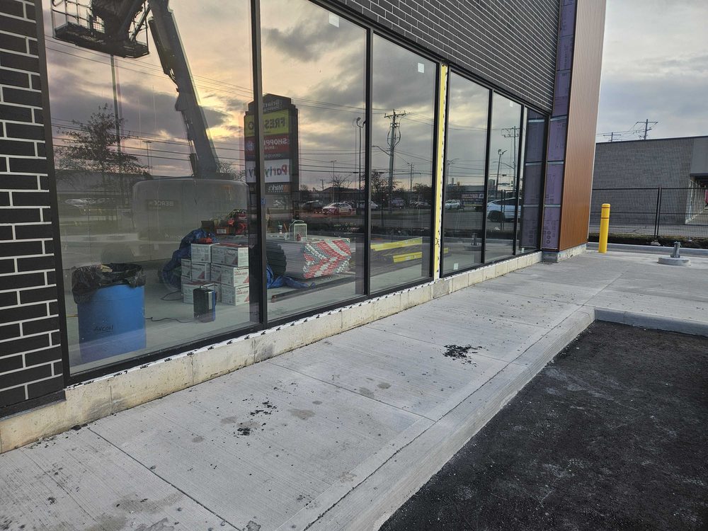 Aluminum storefront elevation installed by Canuck Door Systems for Avcon Construction Inc in Toronto