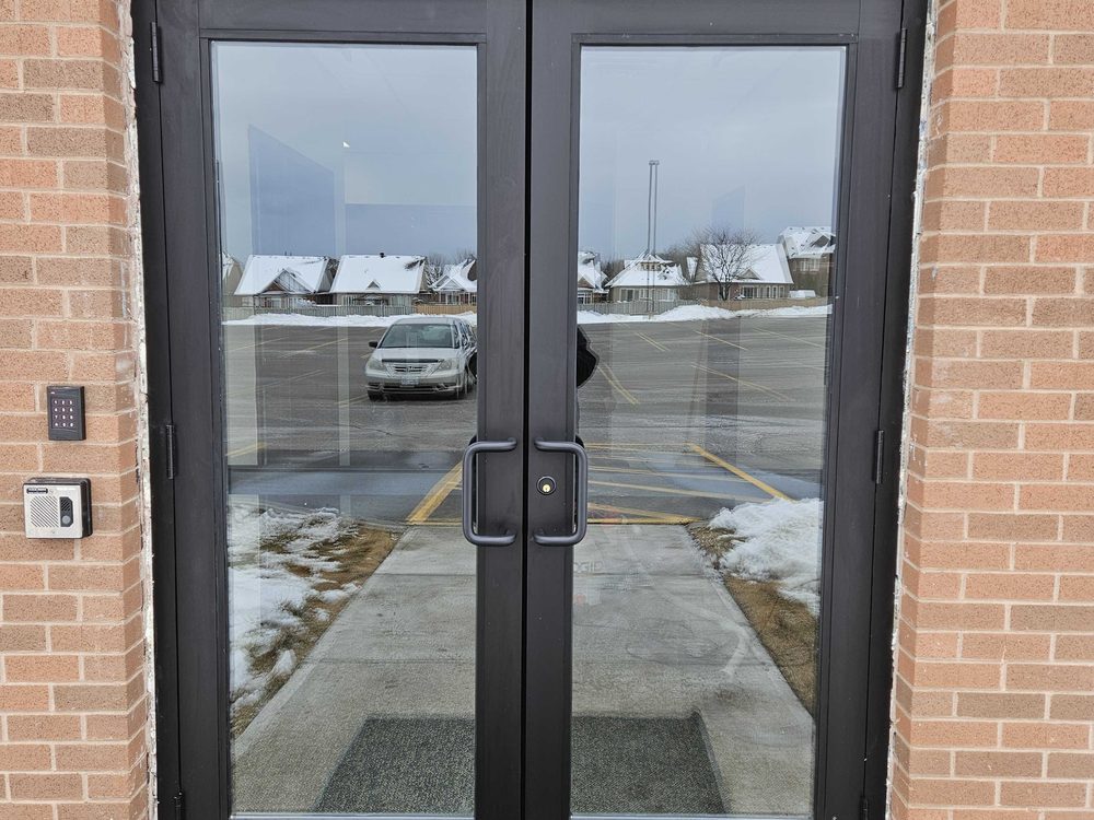 Aluminum storefront entrance doors installed by Canuck Door Systems