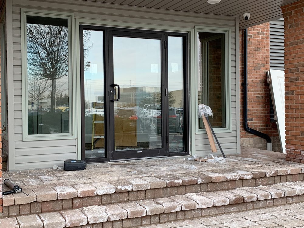 Aluminum storefront entrance doors installed by Canuck Door Systems